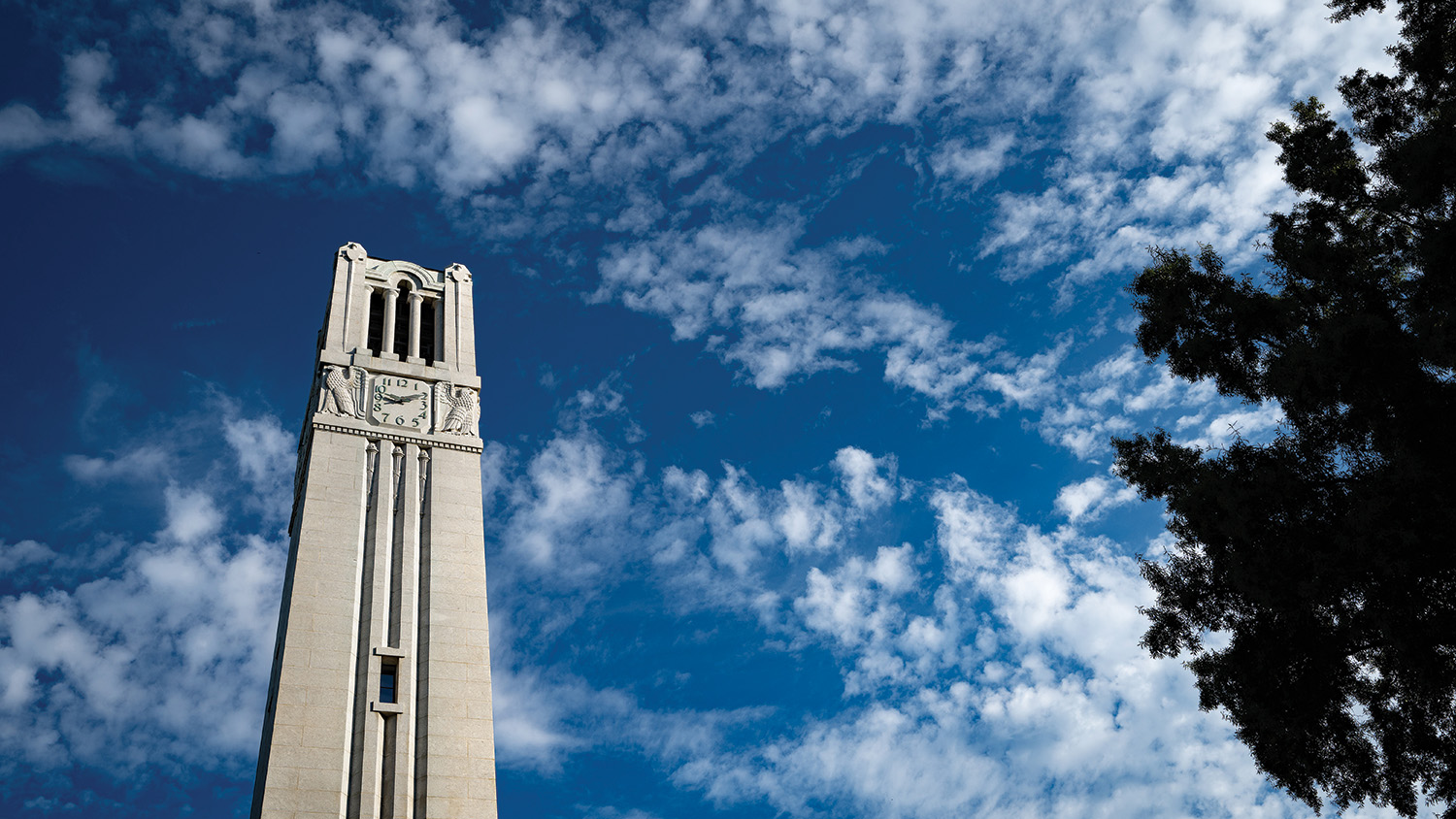 The Memorial Belltower against a cloudy sky.