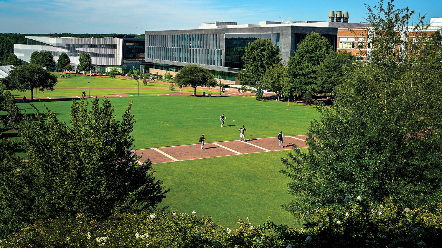 Students walk through the Engineering Oval on NC State's Centennial Campus.