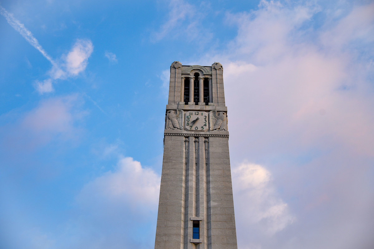 A picture of the Memorial Belltower surrounded by clouds.