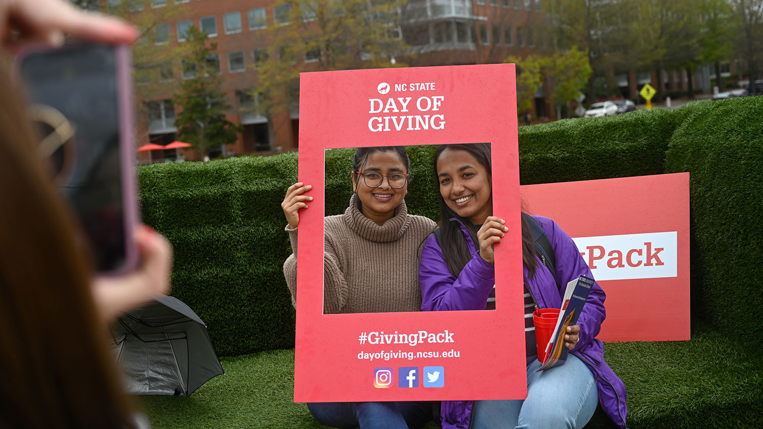 Students pose for a photo during a student Day of Giving event.
